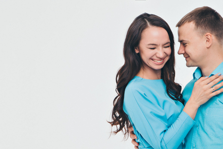portrait of a man and a woman on a white background. Pair in blueの写真素材