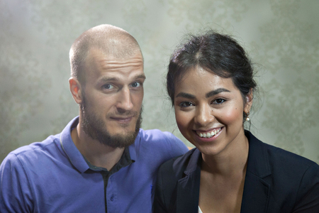 portrait of a man and a woman on a grey background. Pair in blueの写真素材