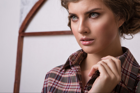 cropped photo: a girl holds the hand of a person. Model posing in a dress. Item of clothing close-upの写真素材