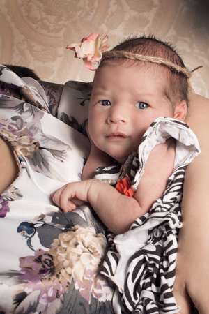 baby on the hands of mother. woman and childの写真素材