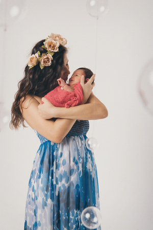 Woman holding child in her armsの写真素材