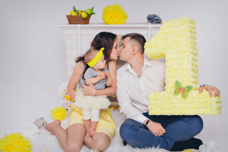 Family portrait on the floor on white backgroundの写真素材