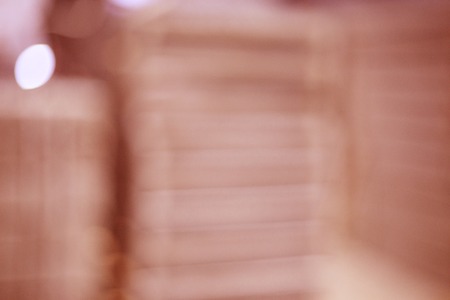 blurred photo: plates stacked on top of each other in red colourの写真素材