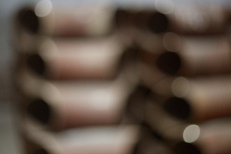 blurry photo: pipe stacked on top of each otherの写真素材
