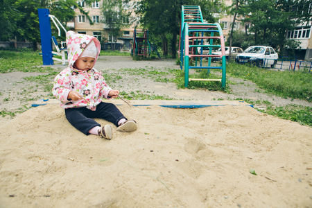 a ittle girl playing in the Playgroundの写真素材