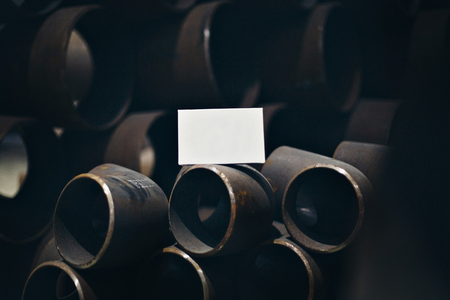 white sheet of paper inside a large iron pipeの写真素材