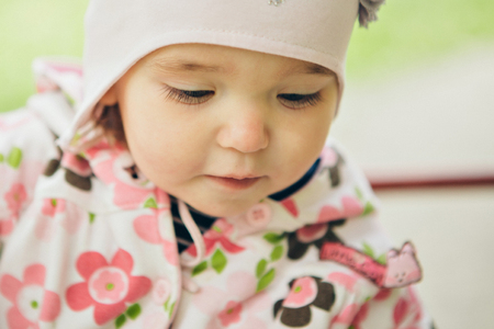 portrait of a little girl: baby's face close-upの写真素材