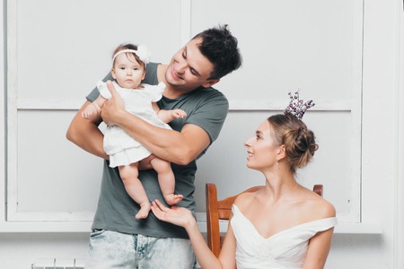 Family portrait of a man, a woman and their babyの写真素材