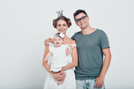 Family photo of a man, a woman and their babyの写真素材