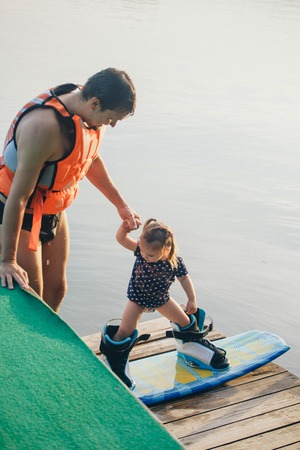Young girl Water skier on a beautiful scenic lakeの写真素材