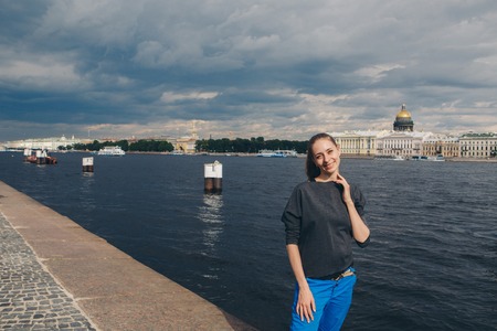 beautiful girl walking along the river Bankの写真素材