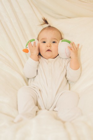 a little kid in headphones with a snowman faceの写真素材