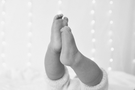 the feet of a newborn baby close-upの写真素材