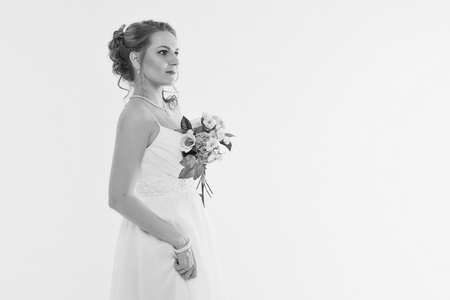 girl with a bouquet of flowers. Bride sniffing bouquetの写真素材