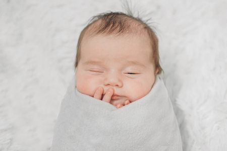 portrait of a little girl: baby's face close-upの写真素材
