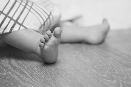 the feet of a newborn baby close-upの写真素材
