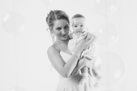 newborn baby in the arms of the mother. Woman holding a childの写真素材