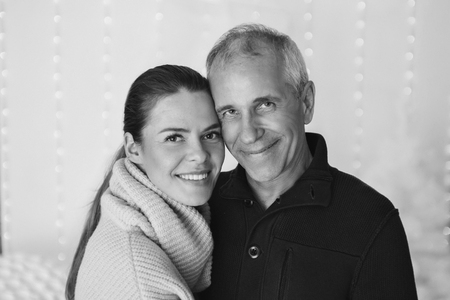 couple in love hugs on white background. man and woman smiling. Valentine's dayの写真素材
