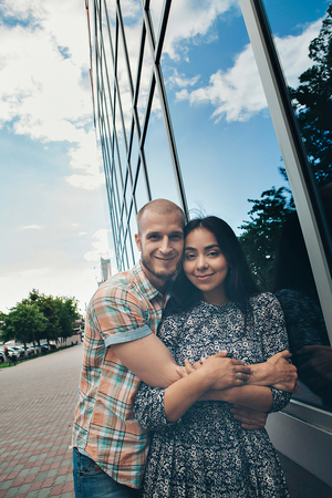 couple in love hugs. Caucasian man and asian woman smiling. Valentines dayの写真素材