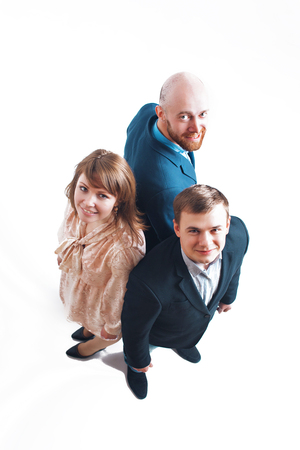 top view: three people back to back. Men and women in business suitsの写真素材