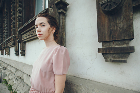 portrait of a beautiful girl on the background of the urban landscapeの写真素材