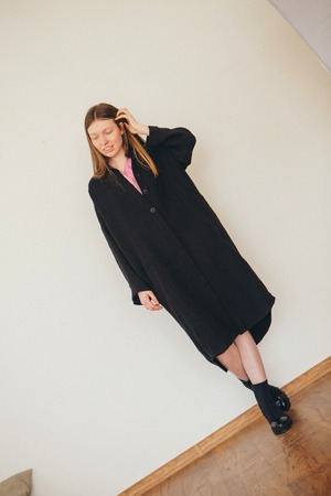 beautiful girl in long linen coat on white background. Model in advertising clothingの写真素材