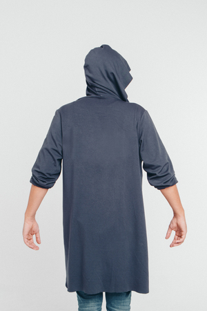 handsome man shows off gray clothes on white backgroundの写真素材