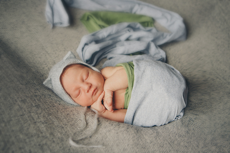 newborn baby in a hat with earsの写真素材