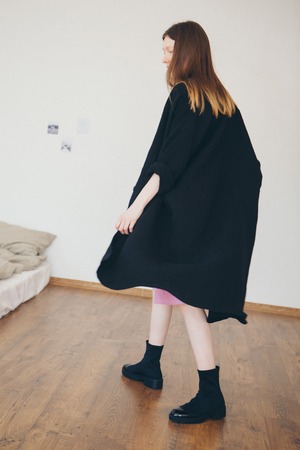 beautiful girl in long linen coat on white background. Model in advertising clothingの写真素材