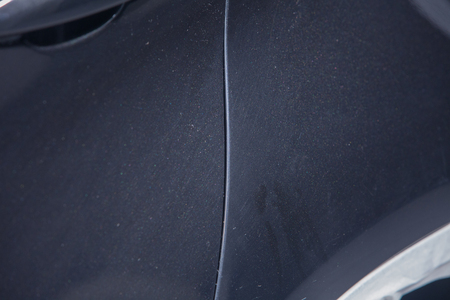 the metal surface of the car and headlight. Blue Pearl paint on the carの写真素材