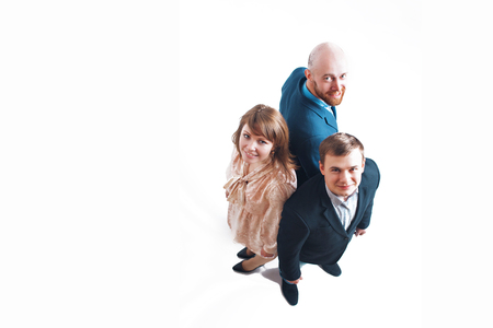 top view: three people back to back. Men and women in business suitsの写真素材