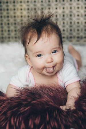 portrait of a newborn baby with his tongue sticking outの写真素材