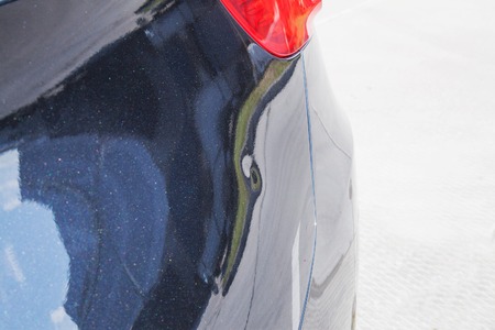 the metal surface of the car and headlight. Blue Pearl paint on the carの写真素材