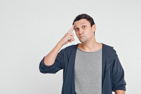 portrait of man thoughtful. Guy with hands on face isolated on white backgroundの写真素材