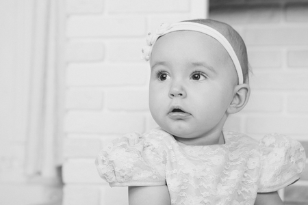 the face of a child with a bandage on his head close-upの写真素材
