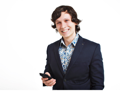 Smiling business man talking on the cell phone, isolated on white backgroundの写真素材