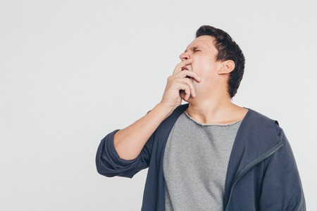 portrait of man thoughtful. Guy with hands on face isolated on white backgroundの写真素材