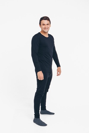 handsome man shows off gray clothes on white backgroundの写真素材