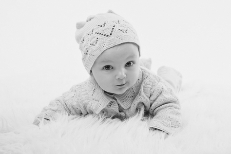 newborn baby lies in a beautiful hatの写真素材