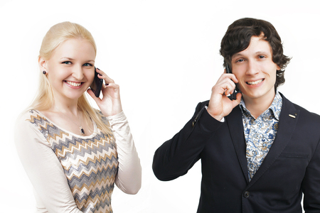 portrait of 2 businessmen on a white background. A man , a woman talking on the phoneの写真素材