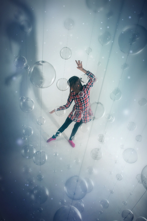 the view from the top: pregnant woman on white background with glass balls. Woman in red and blue clothesの写真素材