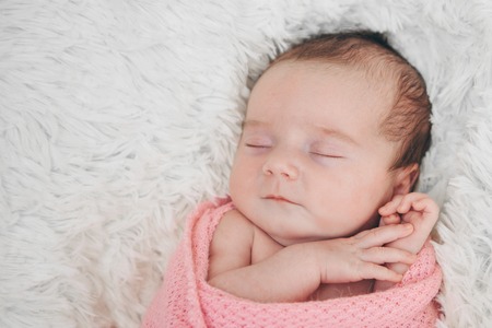 portrait of a little girl: baby's face close-upの写真素材