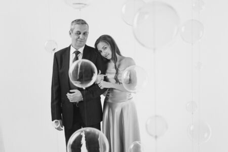 couple in love hugs on white background. man and woman smiling. Valentines dayの写真素材