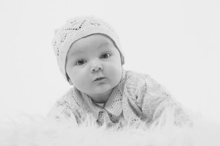 newborn baby lies in a beautiful hatの写真素材
