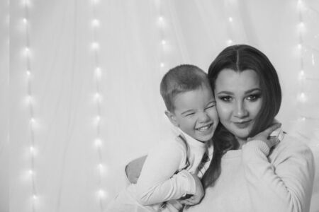 baby in the arms of the mother. Woman holding a childの写真素材