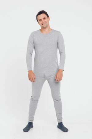 handsome man shows off gray clothes on white backgroundの写真素材