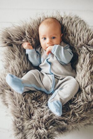 newborn baby wrapped in a blanket sleeping in a basket