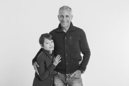 Dad holds the baby in his arms. The concept of educating the father of young children, Happy childhood, a friendly family.の写真素材