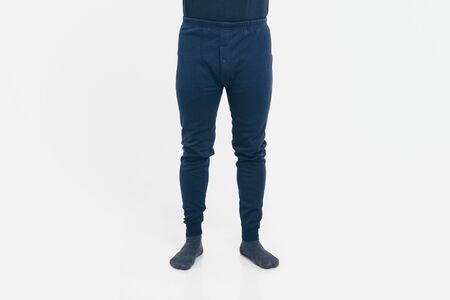 the concept of advertising clothing, fashion show - men's pants and socks. Pajamas on white background. Copy spaceの写真素材