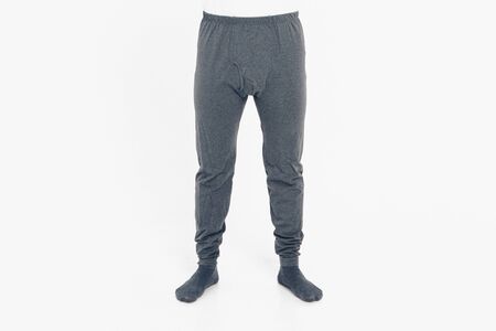 the concept of advertising clothing, fashion show - men's pants and socks. Pajamas on white background. Copy spaceの写真素材